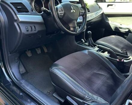 Черный Мицубиси Лансер, объемом двигателя 2 л и пробегом 230 тыс. км за 7000 $, фото 12 на Automoto.ua