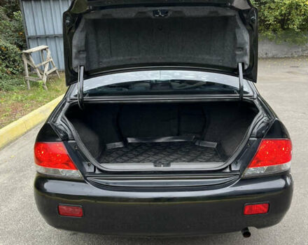 Чорний Міцубісі Lancer, об'ємом двигуна 1.58 л та пробігом 192 тис. км за 4500 $, фото 19 на Automoto.ua