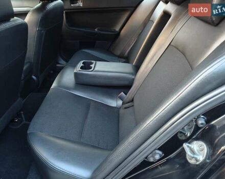 Черный Мицубиси Лансер, объемом двигателя 2 л и пробегом 245 тыс. км за 5600 $, фото 8 на Automoto.ua