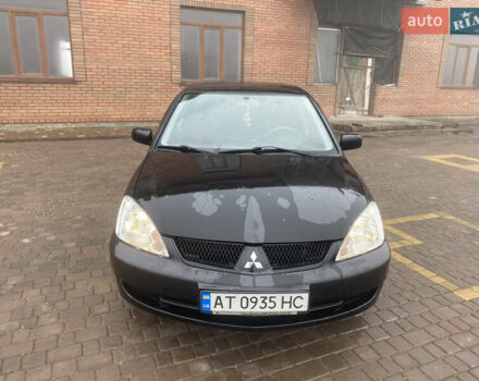 Черный Мицубиси Лансер, объемом двигателя 1.58 л и пробегом 211 тыс. км за 6333 $, фото 12 на Automoto.ua