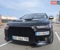 Черный Мицубиси Лансер, объемом двигателя 2 л и пробегом 240 тыс. км за 10000 $, фото 1 на Automoto.ua