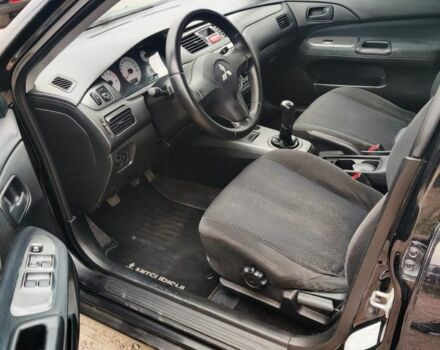 Чорний Міцубісі Lancer, об'ємом двигуна 1.6 л та пробігом 257 тис. км за 4200 $, фото 7 на Automoto.ua