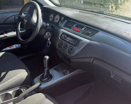 Черный Мицубиси Лансер, объемом двигателя 1.58 л и пробегом 205 тыс. км за 4500 $, фото 5 на Automoto.ua