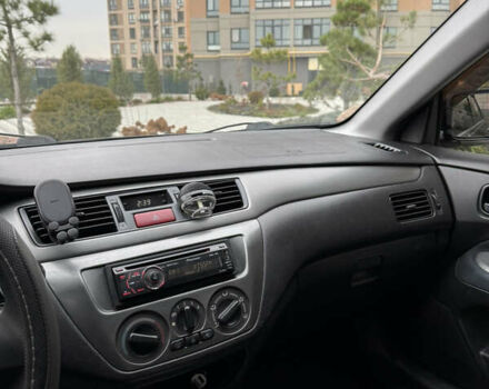 Черный Мицубиси Лансер, объемом двигателя 1.6 л и пробегом 240 тыс. км за 5200 $, фото 11 на Automoto.ua