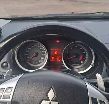 Черный Мицубиси Лансер, объемом двигателя 2 л и пробегом 211 тыс. км за 6900 $, фото 11 на Automoto.ua