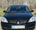 Черный Мицубиси Лансер, объемом двигателя 1.6 л и пробегом 230 тыс. км за 4600 $, фото 1 на Automoto.ua