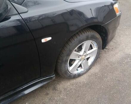 Черный Мицубиси Лансер, объемом двигателя 2 л и пробегом 192 тыс. км за 6350 $, фото 8 на Automoto.ua