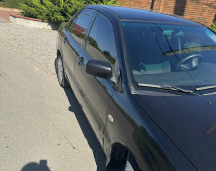 Черный Мицубиси Лансер, объемом двигателя 1.58 л и пробегом 205 тыс. км за 4500 $, фото 1 на Automoto.ua