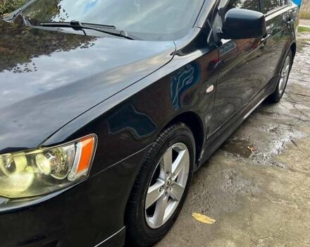 Черный Мицубиси Лансер, объемом двигателя 2 л и пробегом 214 тыс. км за 6300 $, фото 3 на Automoto.ua