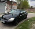 Черный Мицубиси Лансер, объемом двигателя 1.6 л и пробегом 175 тыс. км за 4200 $, фото 1 на Automoto.ua