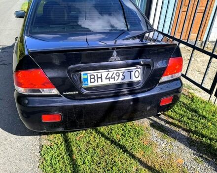 Черный Мицубиси Лансер, объемом двигателя 1.6 л и пробегом 232 тыс. км за 4400 $, фото 7 на Automoto.ua