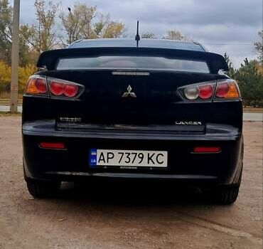 Черный Мицубиси Лансер, объемом двигателя 2 л и пробегом 211 тыс. км за 6900 $, фото 5 на Automoto.ua