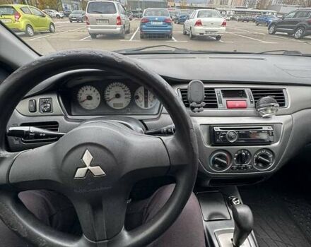 Чорний Міцубісі Lancer, об'ємом двигуна 1.6 л та пробігом 245 тис. км за 4500 $, фото 23 на Automoto.ua