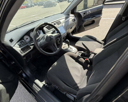 Черный Мицубиси Лансер, объемом двигателя 1.6 л и пробегом 321 тыс. км за 5000 $, фото 22 на Automoto.ua