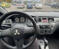 Чорний Міцубісі Lancer, об'ємом двигуна 1.6 л та пробігом 245 тис. км за 4500 $, фото 23 на Automoto.ua