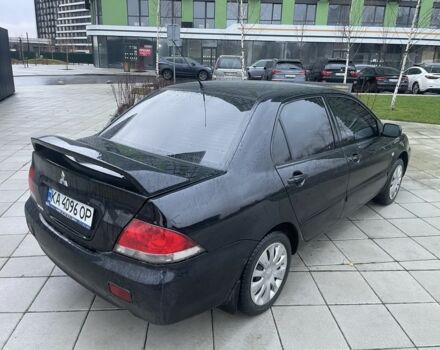 Черный Мицубиси Лансер, объемом двигателя 1.6 л и пробегом 226 тыс. км за 3750 $, фото 4 на Automoto.ua