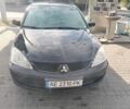 Чорний Міцубісі Lancer, об'ємом двигуна 1.58 л та пробігом 175 тис. км за 5200 $, фото 1 на Automoto.ua