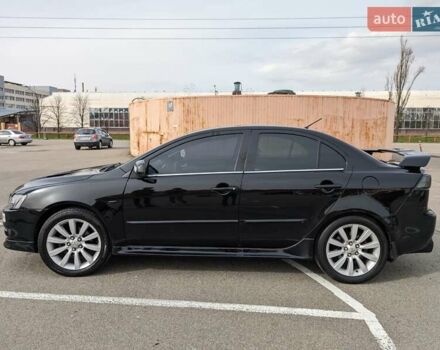 Черный Мицубиси Лансер, объемом двигателя 2 л и пробегом 240 тыс. км за 10000 $, фото 5 на Automoto.ua