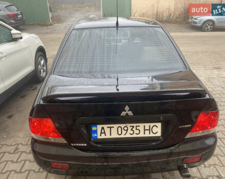 Черный Мицубиси Лансер, объемом двигателя 1.58 л и пробегом 211 тыс. км за 6333 $, фото 22 на Automoto.ua