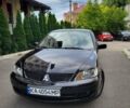 Чорний Міцубісі Lancer, об'ємом двигуна 1.58 л та пробігом 334 тис. км за 4750 $, фото 1 на Automoto.ua