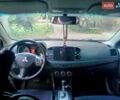 Черный Мицубиси Лансер, объемом двигателя 2 л и пробегом 180 тыс. км за 5800 $, фото 1 на Automoto.ua