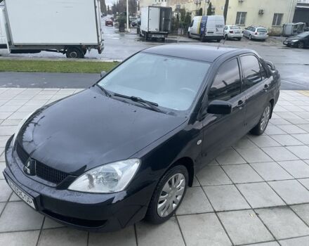 Черный Мицубиси Лансер, объемом двигателя 1.6 л и пробегом 226 тыс. км за 3750 $, фото 1 на Automoto.ua