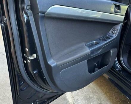 Черный Мицубиси Лансер, объемом двигателя 2 л и пробегом 230 тыс. км за 7000 $, фото 11 на Automoto.ua