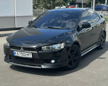Черный Мицубиси Лансер, объемом двигателя 2 л и пробегом 295 тыс. км за 7000 $, фото 1 на Automoto.ua