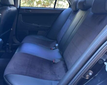 Черный Мицубиси Лансер, объемом двигателя 2 л и пробегом 230 тыс. км за 7000 $, фото 8 на Automoto.ua