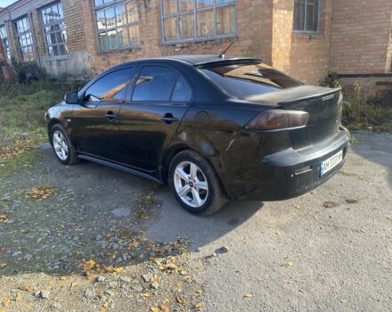 Черный Мицубиси Лансер, объемом двигателя 2 л и пробегом 190 тыс. км за 3100 $, фото 2 на Automoto.ua