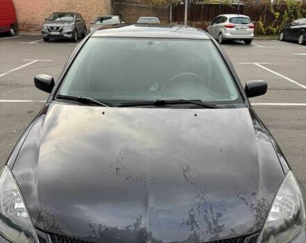 Чорний Міцубісі Lancer, об'ємом двигуна 1.6 л та пробігом 245 тис. км за 4500 $, фото 1 на Automoto.ua