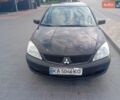 Чорний Міцубісі Lancer, об'ємом двигуна 1.6 л та пробігом 287 тис. км за 4500 $, фото 1 на Automoto.ua