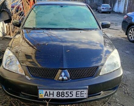 Черный Мицубиси Лансер, объемом двигателя 1.6 л и пробегом 140 тыс. км за 2500 $, фото 1 на Automoto.ua