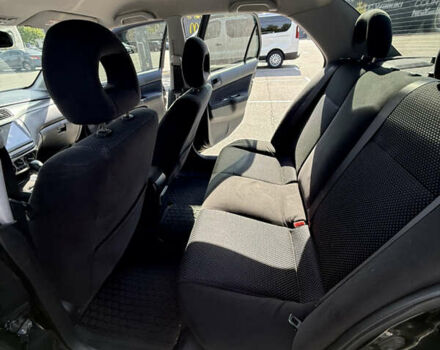 Черный Мицубиси Лансер, объемом двигателя 1.6 л и пробегом 321 тыс. км за 5000 $, фото 23 на Automoto.ua