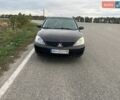 Черный Мицубиси Лансер, объемом двигателя 1.6 л и пробегом 305 тыс. км за 4200 $, фото 1 на Automoto.ua