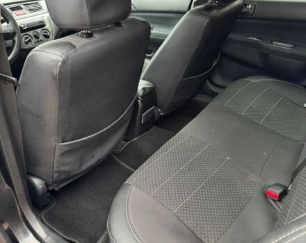 Чорний Міцубісі Lancer, об'ємом двигуна 1.6 л та пробігом 220 тис. км за 3600 $, фото 12 на Automoto.ua