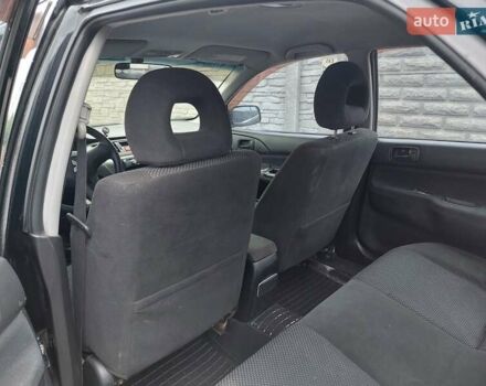 Чорний Міцубісі Lancer, об'ємом двигуна 1.6 л та пробігом 215 тис. км за 4900 $, фото 11 на Automoto.ua