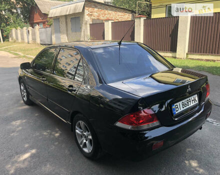 Чорний Міцубісі Lancer, об'ємом двигуна 1.6 л та пробігом 285 тис. км за 5000 $, фото 3 на Automoto.ua