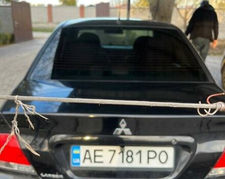 Чорний Міцубісі Lancer, об'ємом двигуна 1.6 л та пробігом 324 тис. км за 3800 $, фото 1 на Automoto.ua