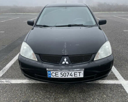 Черный Мицубиси Лансер, объемом двигателя 1.58 л и пробегом 214 тыс. км за 4400 $, фото 5 на Automoto.ua