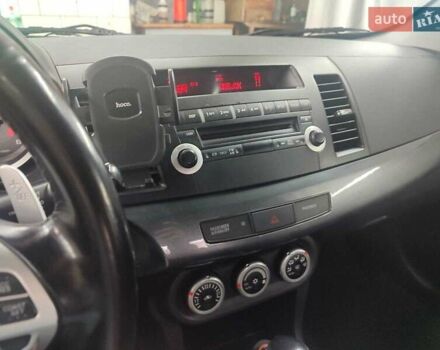 Черный Мицубиси Лансер, объемом двигателя 2 л и пробегом 229 тыс. км за 7300 $, фото 10 на Automoto.ua