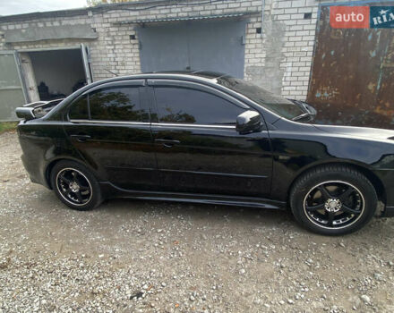 Черный Мицубиси Лансер, объемом двигателя 2 л и пробегом 275 тыс. км за 7700 $, фото 2 на Automoto.ua