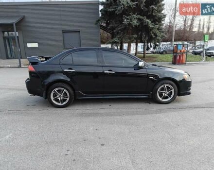 Черный Мицубиси Лансер, объемом двигателя 2 л и пробегом 245 тыс. км за 5600 $, фото 5 на Automoto.ua