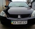 Чорний Міцубісі Lancer, об'ємом двигуна 1.58 л та пробігом 207 тис. км за 6000 $, фото 1 на Automoto.ua