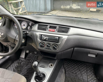 Чорний Міцубісі Lancer, об'ємом двигуна 1.58 л та пробігом 192 тис. км за 4500 $, фото 12 на Automoto.ua