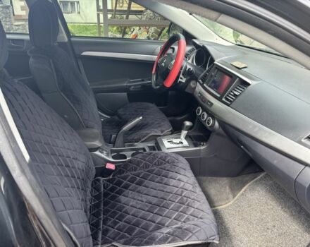 Черный Мицубиси Лансер, объемом двигателя 2 л и пробегом 210 тыс. км за 6250 $, фото 14 на Automoto.ua