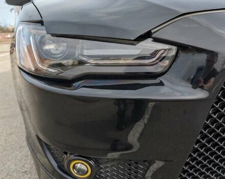 Черный Мицубиси Лансер, объемом двигателя 2 л и пробегом 240 тыс. км за 10000 $, фото 4 на Automoto.ua