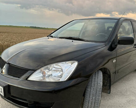 Чорний Міцубісі Lancer, об'ємом двигуна 1.58 л та пробігом 232 тис. км за 4300 $, фото 9 на Automoto.ua