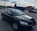 Чорний Міцубісі Lancer, об'ємом двигуна 1.6 л та пробігом 310 тис. км за 3500 $, фото 30 на Automoto.ua
