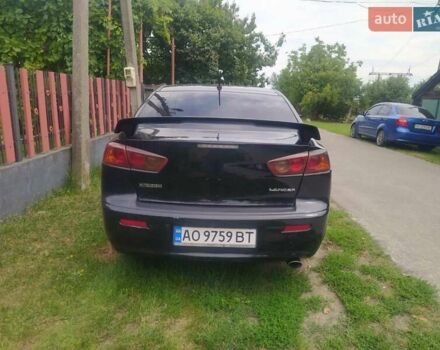 Чорний Міцубісі Lancer, об'ємом двигуна 2 л та пробігом 183 тис. км за 5000 $, фото 4 на Automoto.ua